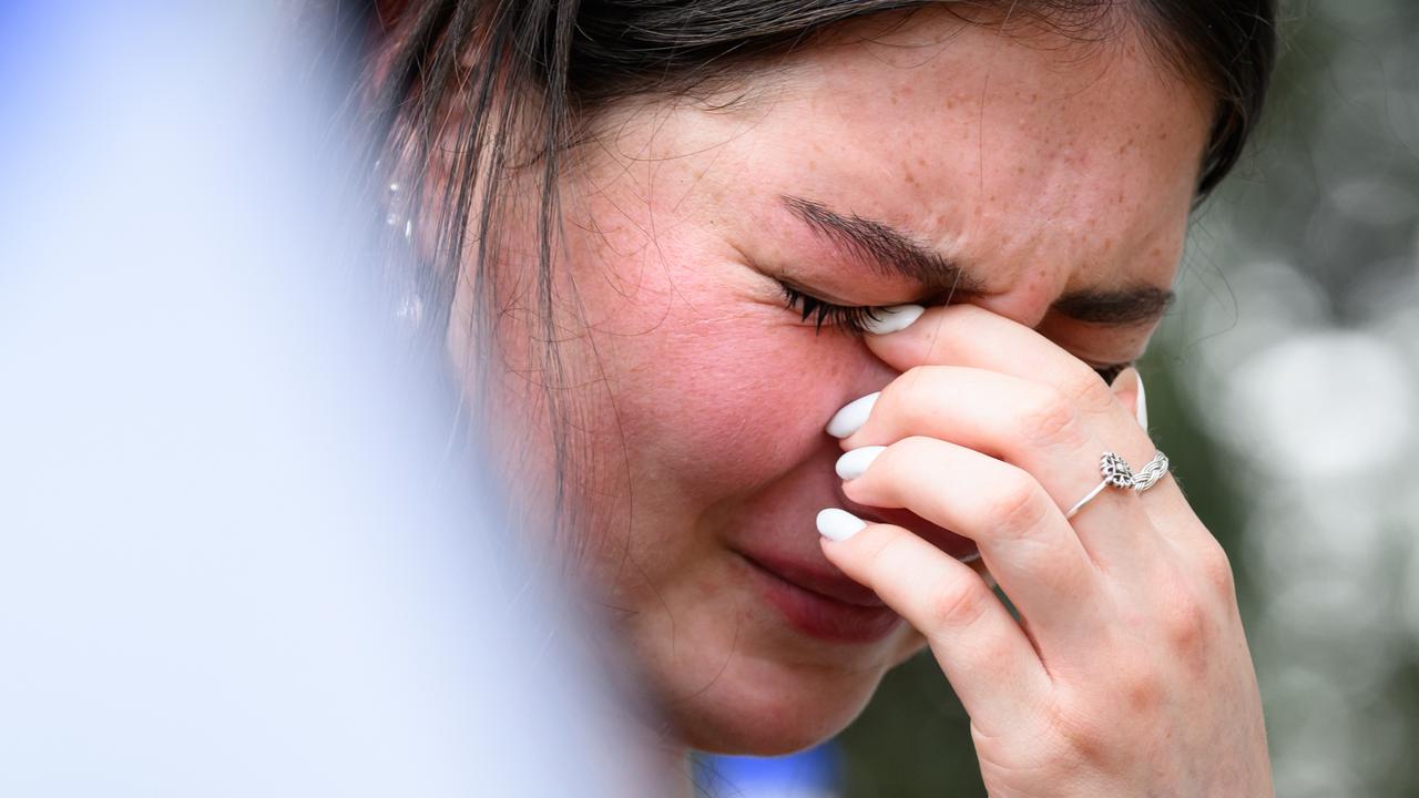 A crying Israeli woman paying her respects at a joint funeral for a mother and son who were killed by Hamas. Picture: Leon Neal/Getty Images