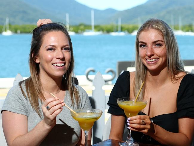 Cool nights have been leading to warm, sunny days with not a cloud in the sky. Melbourne tourists Emma Wooding and Ruby James make the most of the hot weather by cooling down with a frozen daiquiri overlooking the water at Hemmingway's Brewery. Picture: Brendan Radke