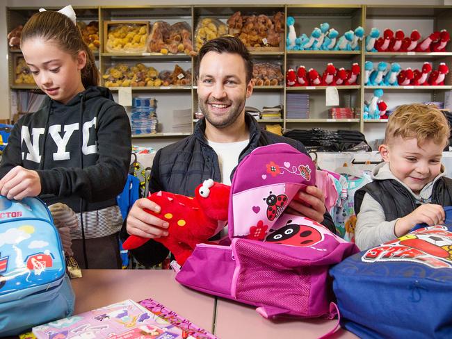 Jimmy packs Buddy Bag's with Sienna, 10, and Mason, 5. Picture: Mark Stewart.