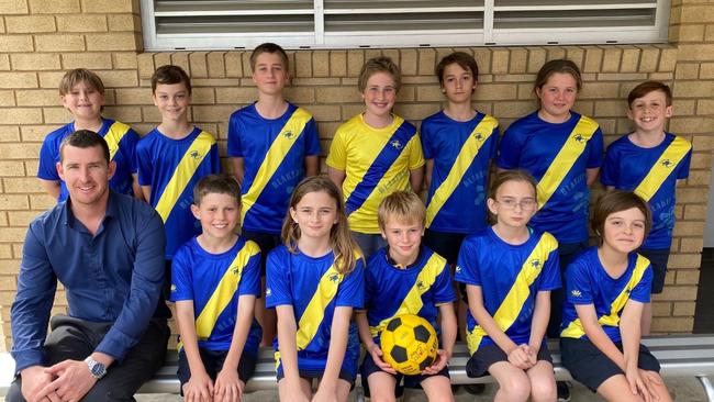 The Blakebrook Public School soccer team, with principal Sam Bowkett, ahead of their 2022 NSW PSSA Small Schools Football Knockout semi-final. Photo: Blakebrook Public School.