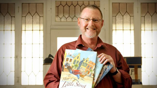 Author Gregory Rogers with his children's books