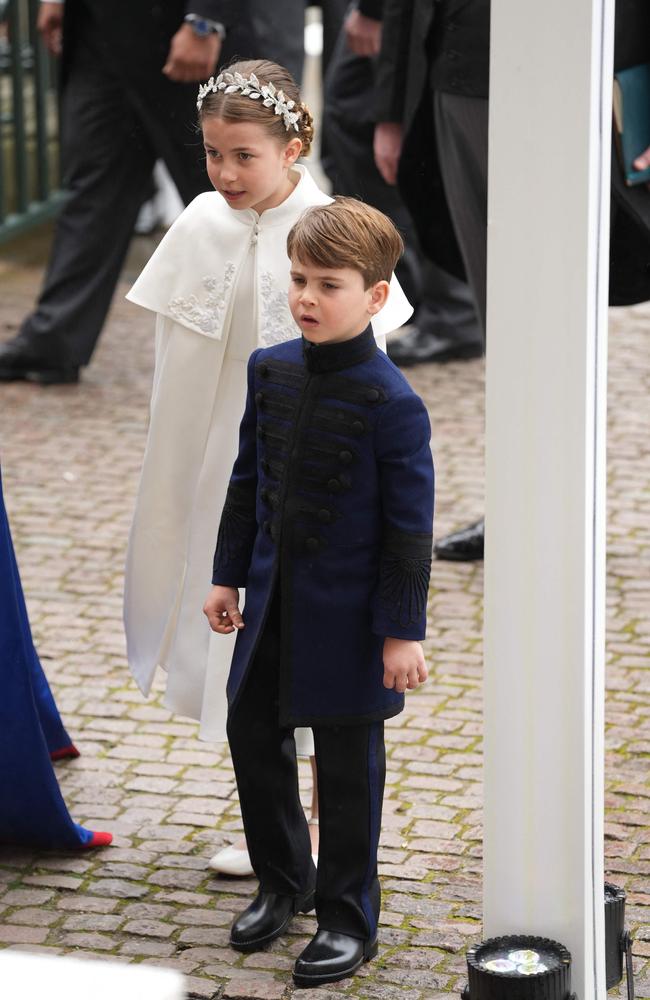 Princess Charlotte of Wales wears Alexander McQueen while Prince Louis is dressed in a blue doeskin tunic by Dege and Skinner. Picture: AFP