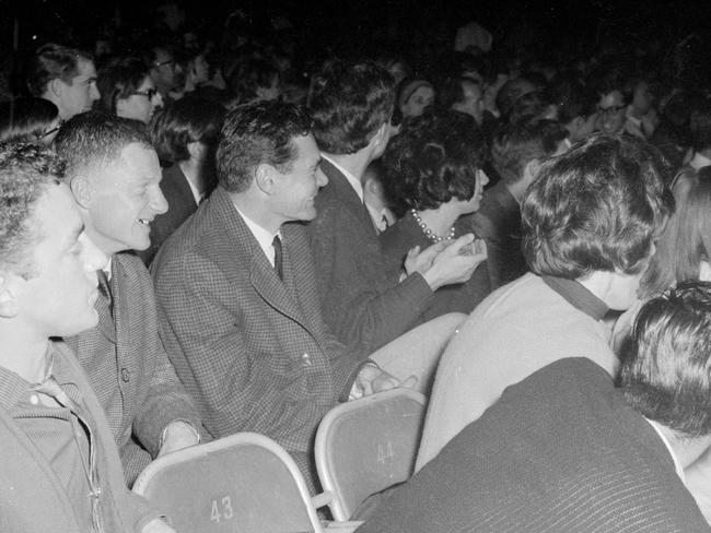 Melbourne Football Club players Ron Barassi and Frank 'Bluey' Adams were among the crowds at the Festival Hall gigs. Picture: Herald Sun Image Library