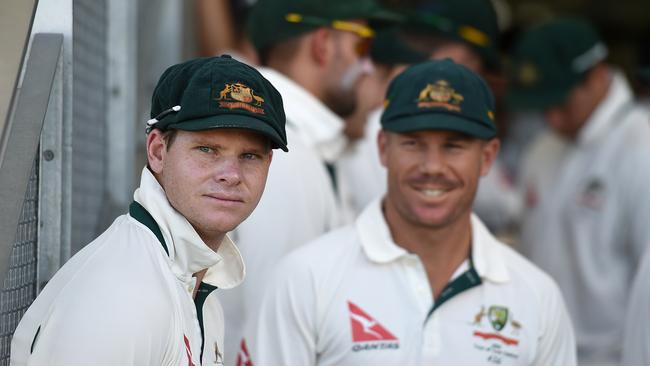 David Warner looks on to Australian captain Steve Smith prior to play on day 1 of the second Test Match between Australia and New Zealand at the Hagley Oval in Christchurch,  Saturday, Feb. 20, 2016. (AAP Image/Dave Hunt) NO ARCHIVING, EDITORIAL USE ONLY, IMAGES TO BE USED FOR NEWS REPORTING PURPOSES ONLY, NO COMMERCIAL USE WHATSOEVER, NO USE IN BOOKS WITHOUT PRIOR WRITTEN CONSENT FROM AAP