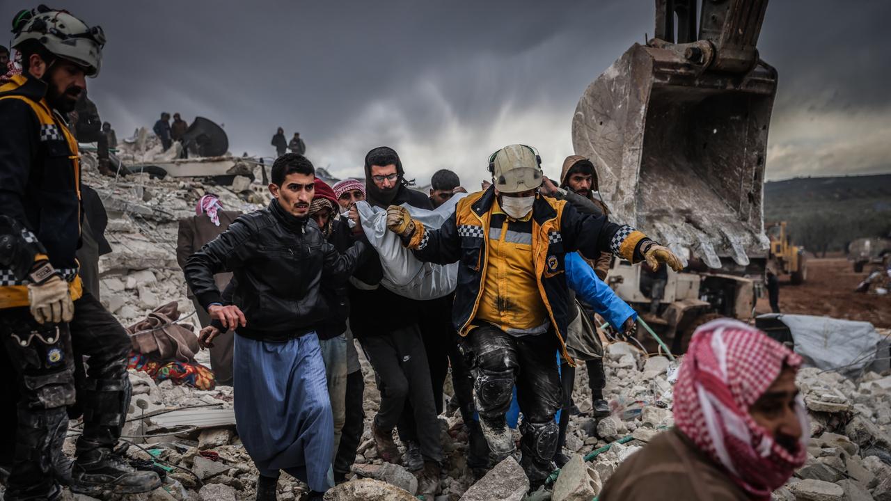 06 February 2023, Syria, Harem: Syrian civilians and members of the White Helmets conduct search and rescue operations in the rubble of a collapsed building following a magnitude 7.8 earthquake that hit Syria. Photo: Anas Alkharboutli/dpa (Photo by Anas Alkharboutli/picture alliance via Getty Images)