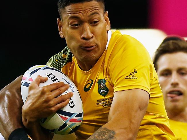 CARDIFF, WALES - SEPTEMBER 23: Israel Folau of Australia makes a break during the 2015 Rugby World Cup Pool A match between Australia and Fiji at the Millennium Stadium on September 23, 2015 in Cardiff, United Kingdom. (Photo by Laurence Griffiths/Getty Images)