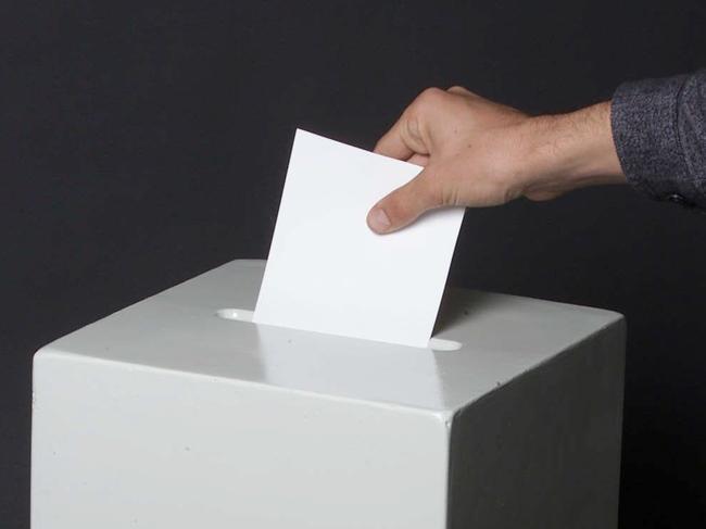 PIRATE: Generic photo of vote being placed in a ballot box during an election in Brisbane, 18/08/2001.