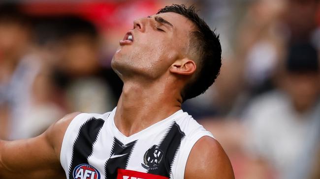 SYDNEY, AUSTRALIA - MARCH 09: Nick Daicos of the Magpies is seen gargling pickle juice after cramping during the 2025 AFL Opening Round match between the GWS Giants and the Collingwood Magpies at ENGIE Stadium on March 9, 2025 in Sydney, Australia. (Photo by Dylan Burns/AFL Photos via Getty Images)