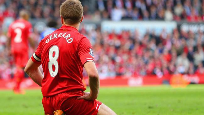 Steven Gerrard of Liverpool on his knees after his costly slip last season.