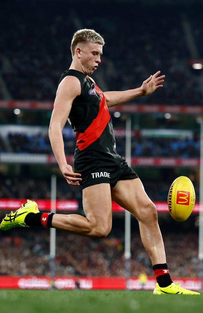 MELBOURNE, AUSTRALIA - JULY 05: Nate Caddy of the Bombers kicks the ball during the 2024 AFL Round 17 match between the Collingwood Magpies and the Essendon Bombers at Melbourne Cricket Ground on July 05, 2024 in Melbourne, Australia. (Photo by Michael Willson/AFL Photos via Getty Images)