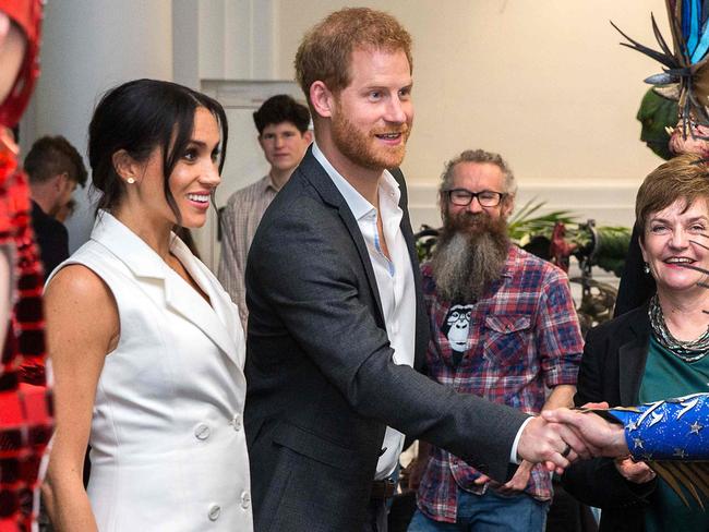 Prince Harry, right, with Meghan Markle, has offered a NZ teen a job when she graduates. Picture: AFP