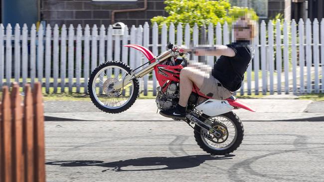 A person riding a motor bike dangerously down a Clarendon Vale street.