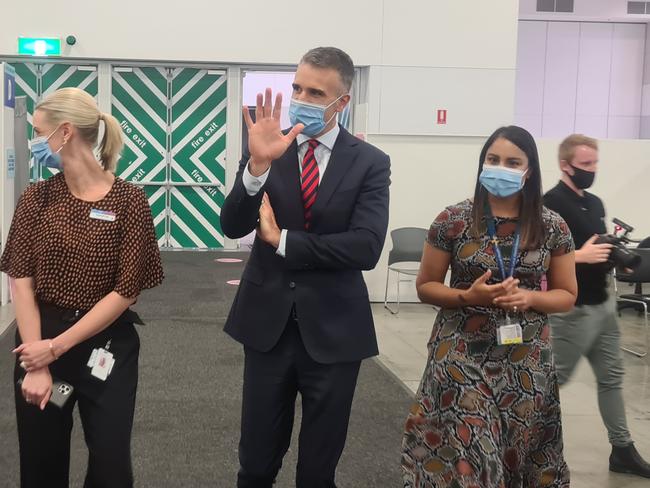 Premier Peter Malinauskas touring the Wayville mass vaccination hub with Central Adelaide Local Health Network Covid-19 commander Rachael Kay (l) and Wayville hub director Usha Ritchie (r) Picture: Andrew Hough