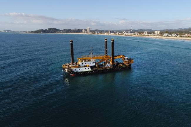 The giant Rock Dredge works on the Artificial reef just offshore from Nineteenth Ave Palm Beach. Picture Glenn Hampson