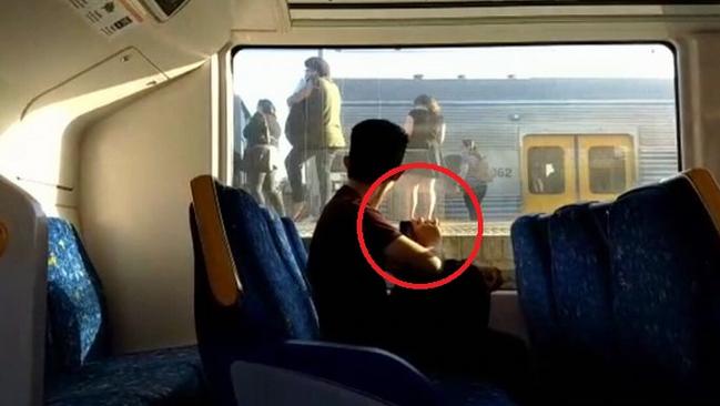 Sydney train commuter snaps at woman for placing her dirty shoes