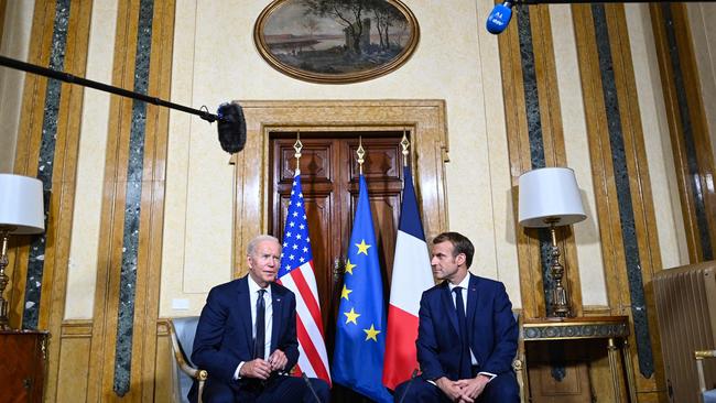 French President Emmanuel Macron (R) and US President Joe Biden (L) meet at the French Embassy to the Vatican in Rome on October 29. Picture: AFP