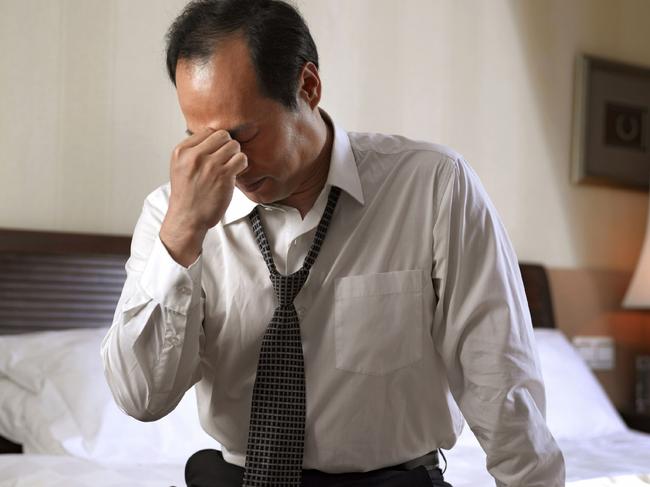 23/02/2012 FEATURES: Businessman sitting on side of bed, looking tired. Tiredness, fatigue, exhaustion, lack of sleep, insomnia, worry. Generic Thinkstock Pic. Supplied