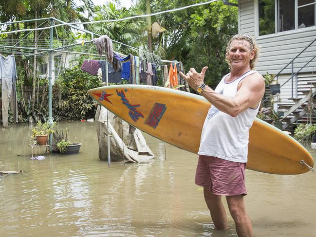 Long time local Greg Copnell  who stayed on despite warnings at at his property in Campbell Street in Hermit Park where the water peaked at the top of his garage. When asked why he stayed, he replied 'if the ship was going down, Im going with it, plus i had plenty of cold beer'. Photo Lachie Millard