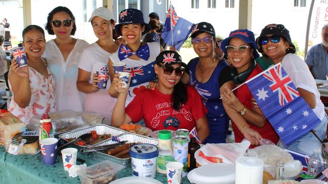 The ‘Beshie Group’, a gathering of the local Filipino community, laying out a sumptuous feast adorned with Australian flags.