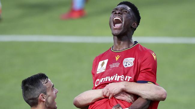 Teenage striker Al Hassan Toure celebrates his opening goal for Adelaide United in the FFA Cup final. Picture: Sarah Reed