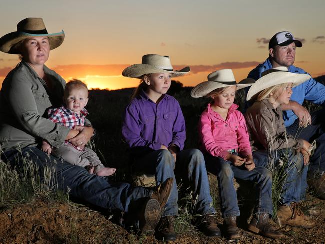 Cattle farmers Shelly and Chris Barnett with son Bill, eight months, and daughter Ella, 11, Lyra, 6, and Lucy 10, on their Mudgee property. Picture: Dean Marzolla