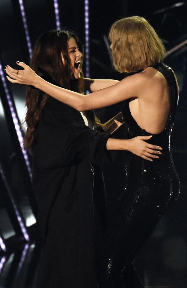 Taylor Swift accepts the award for ‘Album of the Year,’ for ‘1989’ from Selena Gomez during the iHeartRadio Music Awards. Picture: AP