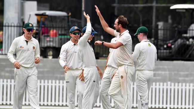 Redlands players celebrate a wicket First grade cricket final between UQ and Redlands Saturday March 25, 2023. Picture, John Gass