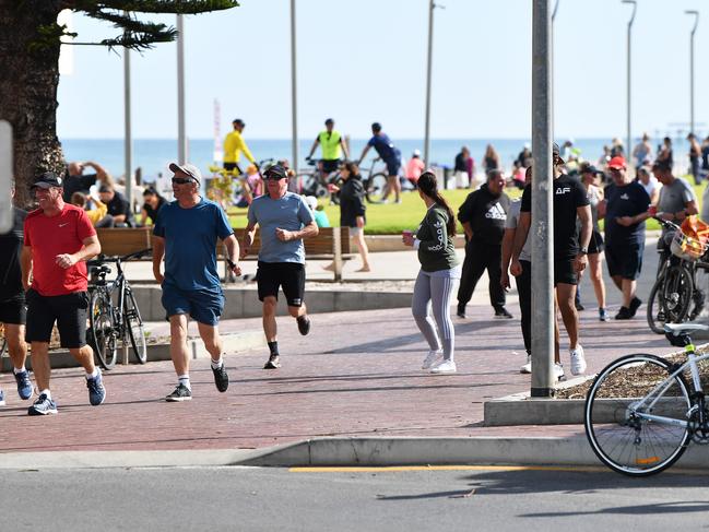 Crowds of people at Henley Beach on Good Friday morning April ,10,2020.(Image AAP/Mark Brake)