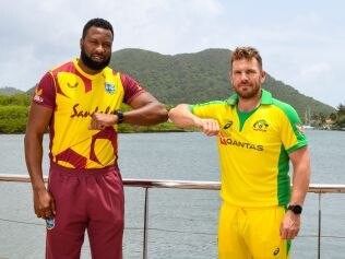 Kieron Pollard (L) of West Indies and Aaron Finch (R) of Australia pose for a photo one day ahead of the 1st T20 between Australia and West Indies at Darren Sammy Cricket Ground, Gros Islet, Saint Lucia, on July 8, 2021. (Photo by Randy Brooks / AFP) (Photo by RANDY BROOKS/AFP via Getty Images)