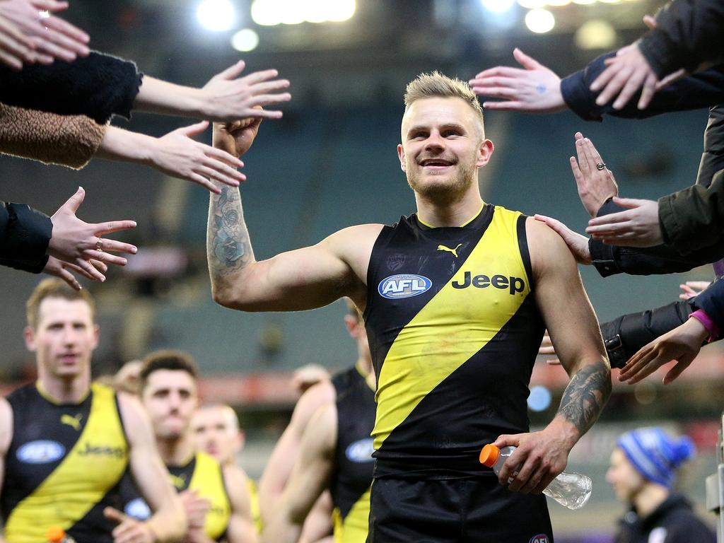 Brandon Ellis of the Tigers celebrates with fans following the Round 20 AFL match between the Richmond Tigers and the Geelong Cats at the MCG in Melbourne, Friday, August 3, 2018. (AAP Image/Hamish Blair) NO ARCHIVING, EDITORIAL USE ONLY