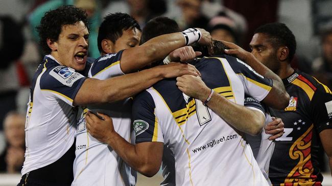 CANBERRA, AUSTRALIA - JULY 19: Brumbies players celebrate a try by Nic White during the Super Rugby Qualifying FInal match between the Brumbies and the Chiefs at GIO Stadium on July 19, 2014 in Canberra, Australia. (Photo by Stefan Postles/Getty Images)