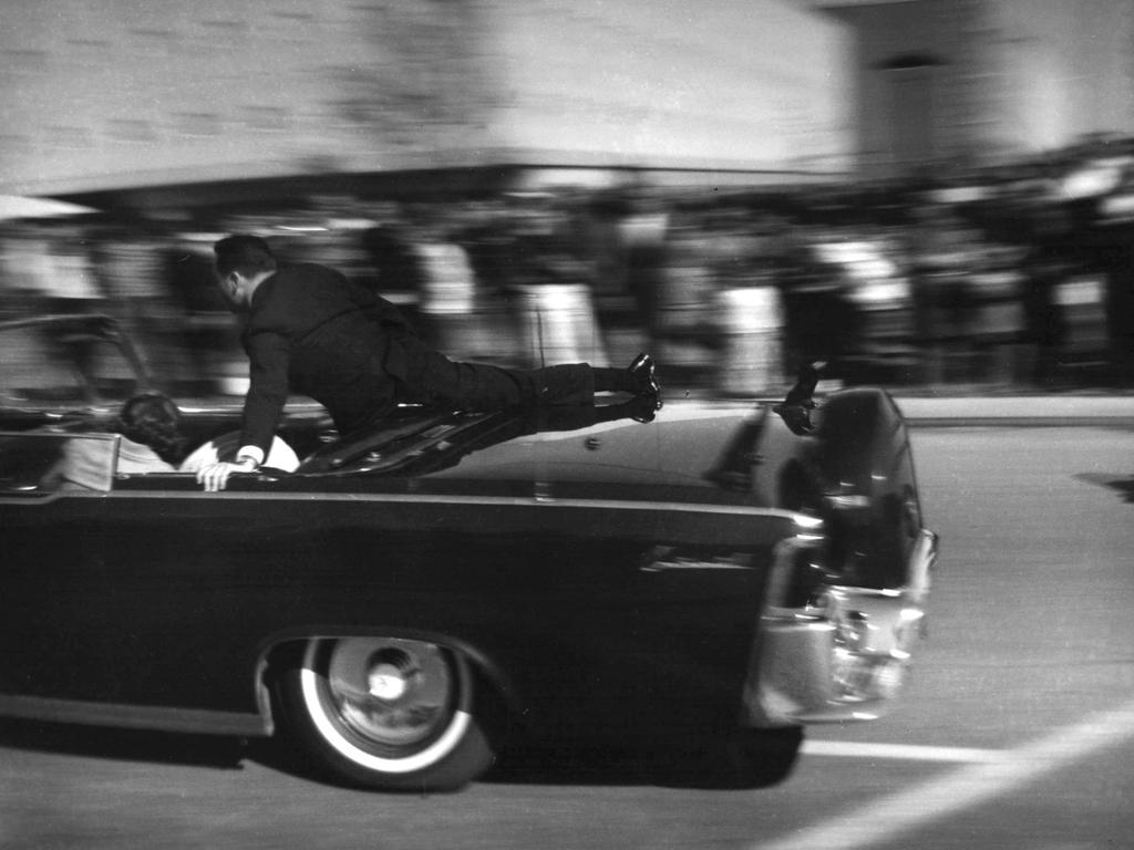 The limousine carrying President John F. Kennedy races toward the hospital seconds after he was shot on November 22, 1963, in Dallas. Picture: AP Photo/Justin Newman