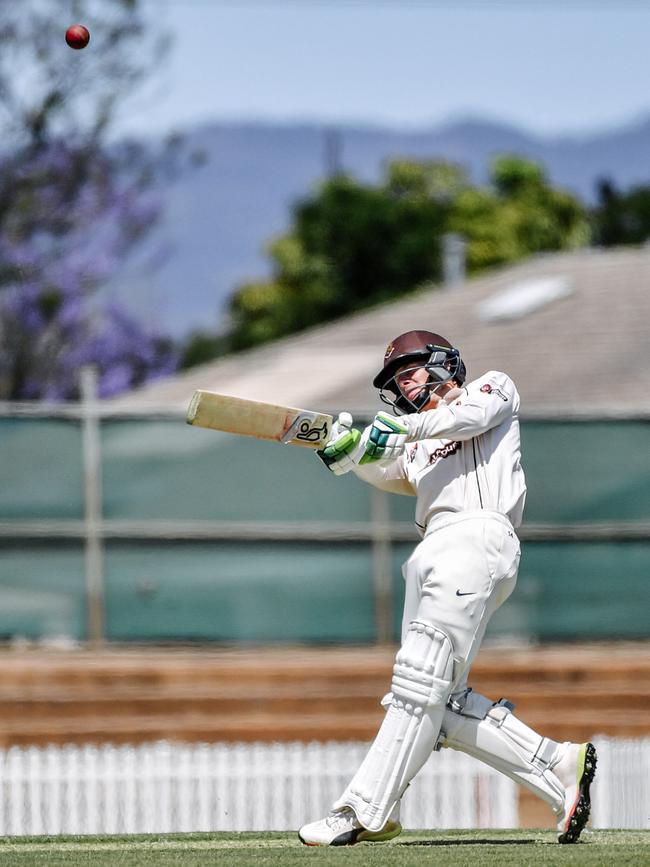 Kensington’s Robbie White belts a six on his way to 185 in grade cricket against Woodville at Woodville Oval. Picture: AAP/Morgan Sette.