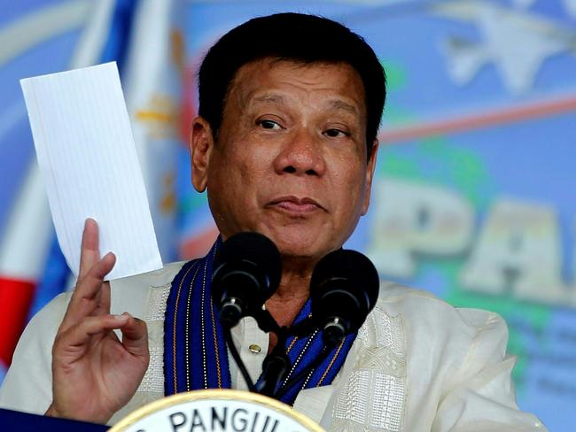 This handout photo released and taken by the Presidential Communications Operations Office on July 5, 2016 shows Philippine President Rodrigo Duterte delivering a speech during the Philippine Air Force's 69th anniversary celebration at Clark airbase in Angeles City, Pampanga province, north of Manila. Duterte on July 5 publicly named five top police officials he said should be investigated for involvement in illegal drugs. The president, who won elections in May by promising a ruthless war on crime, was making good on an earlier threat to publicly shame officers who were involved in or protecting the illegal drug trade. / AFP PHOTO / Rey BANIQUET / --- EDITORS NOTE --- RESTRICTED TO EDITORIAL USE - MANDATORY CREDIT 