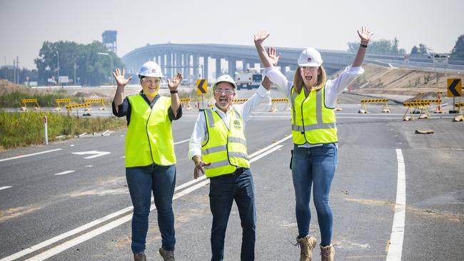 Transport for NSW project manager Yvonne Bowles, Member for Clarence Chris Gulaptis and Regional Director Northern from Transport for NSW regional director northern Anna Andrews give a jump for joy after seeing the new Harwood bridge open. Photo: Adam Hourigan