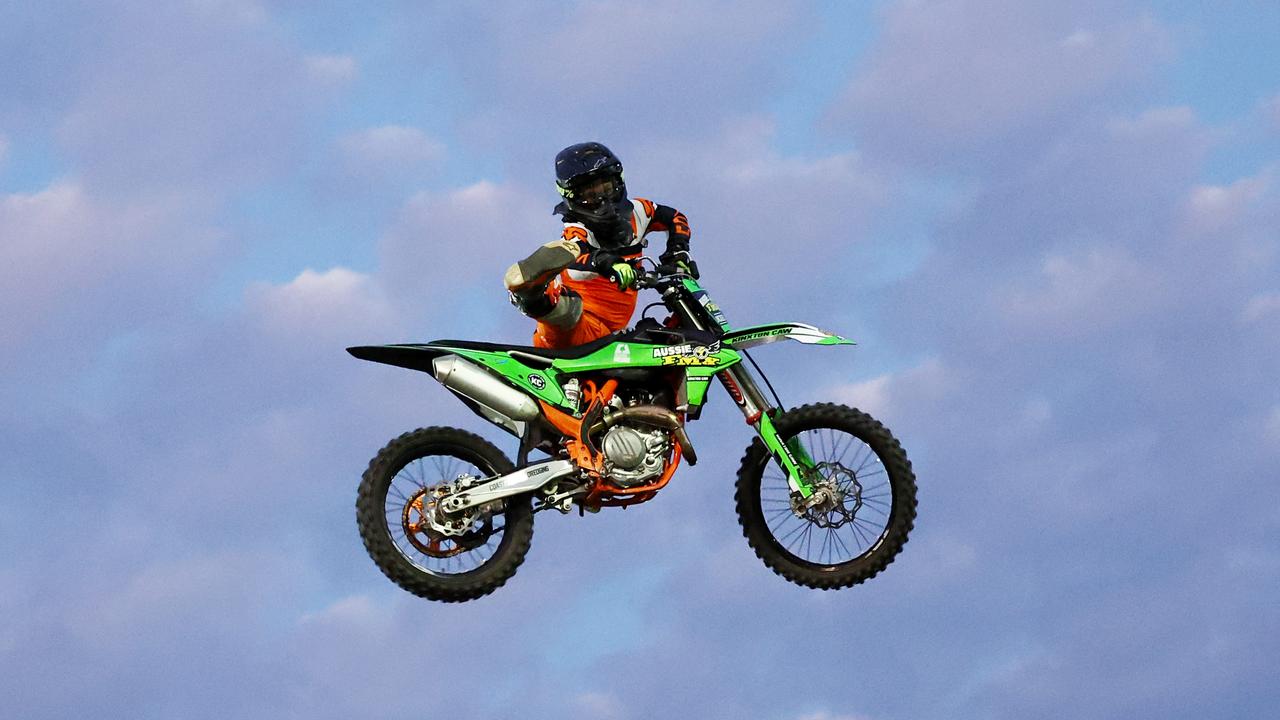 Brodie Karmichael jumps his motocross bike at the 2024 Cairns Bull Throttle event, a bikes and bulls show, featuring bull riding and freestyle motocross riders at the Cairns Showgrounds. Picture: Brendan Radke