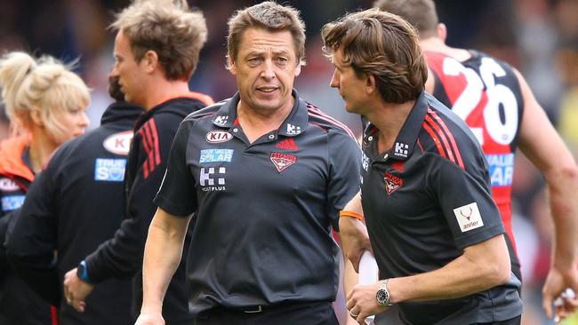 Mark Thompson talks to James Hird during a game in 2013.