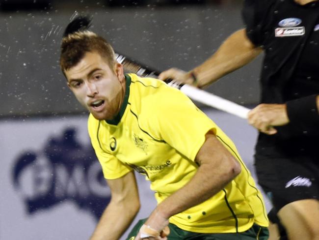 International hockey Australia v New Zealand in Hobart, picture of Jake Whetton for Australia left with Simon Child for NZ chasing