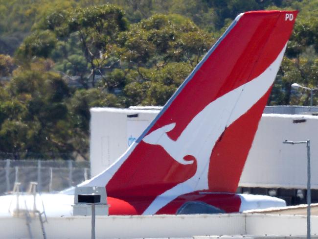 MELBOURNE, AUSTRALIA - NewsWire Photos FEBRUARY 25, 2021: The tail of a QANTAS plane appears above the terminal at Melbourne Airport (Tullamarine). Picture: NCA NewsWire / Andrew Henshaw