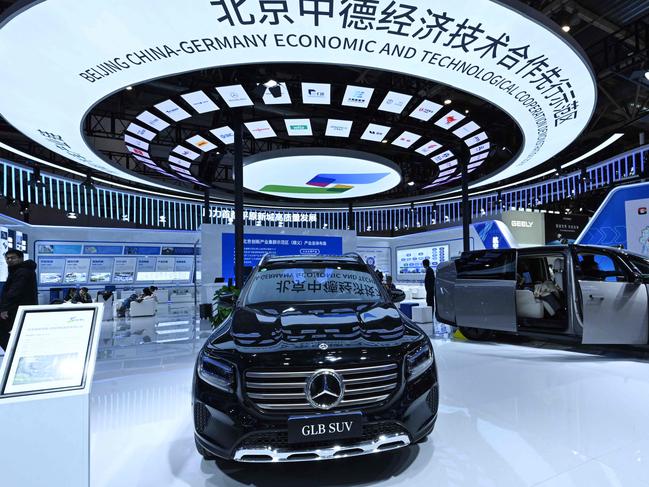 People visit the booth of Mercedes during the 2nd China International Supply Chain Expo in Beijing on November 28, 2024. (Photo by ADEK BERRY / AFP)