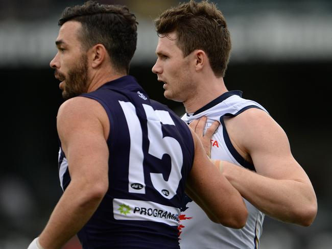 Fremantle's Ryan Crowley keeps a close check on Adelaide's Patrick Dangerfield in the third term. Photo by Daniel Wilkins.