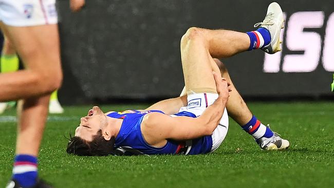 Easton Wood immediately grabbed for his hamstring after an awkward clash during the Dogs’ match against Port Adelaide. Picture: Getty Images