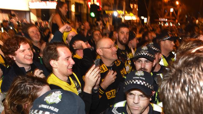 Richmond supporters celebrate into the night after the 2019 grand final. Picture: Tony Gough