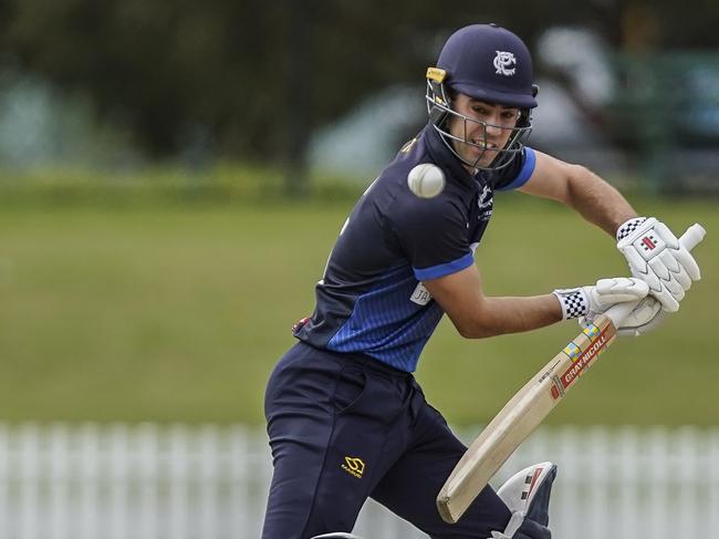 Vic Premier Cricket grand final. Prahran v Dandenong. Dandenong keeper Jacques Augustin and Prahran batsman Damon Egan. Picture: Valeriu Campan