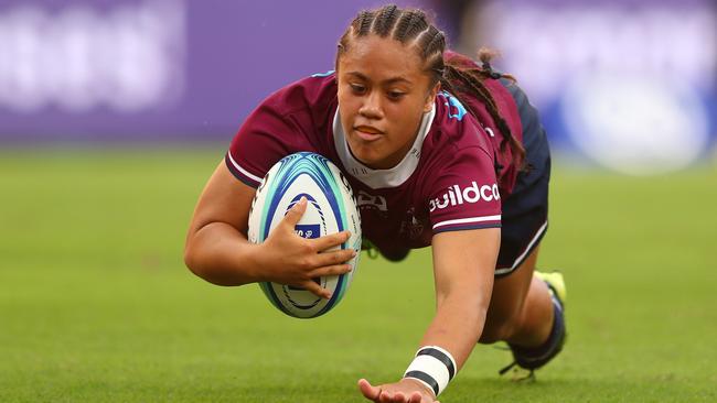 Replacement Queensland halfback Destiny Brill scores a try against the Melbourne Rebels at Suncorp Stadium. Photo: Chris Hyde/Getty Images