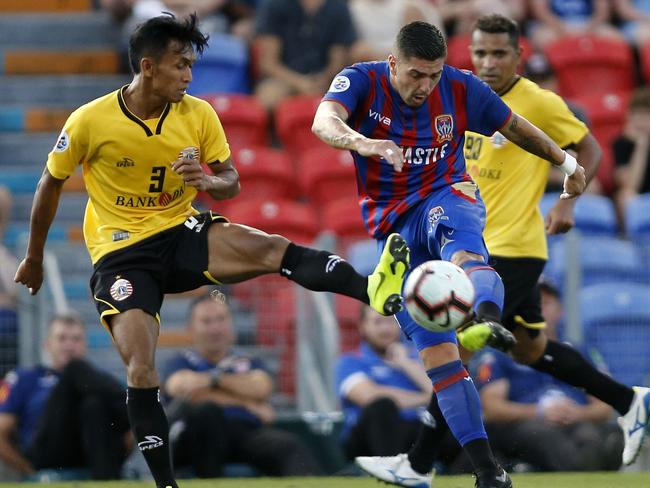 Dany Saputra of Persija blocks a Dimi Petratos shot during the AFC match between the Newcastle Jets and Persija Jakarta at Hunter Stadium in Newcastle, Tuesday, February 12, 2019. (AAP Image/Darren Pateman) NO ARCHIVING, EDITORIAL USE ONLY