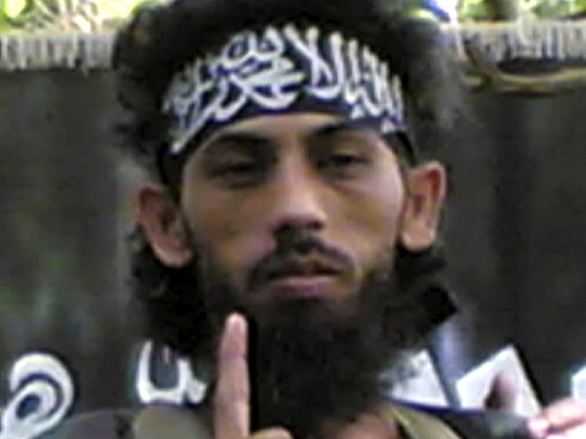 FILE - In this 2007 file photo obtained by the Associated Press from a Philippine security official, Indonesian militant Umar Patek addresses fellow militants in an Abu Sayyaf mountain encampment on Jolo island in southern Philippines. A top anti-terrorism official said Wednesday, Aug. 10, 2011, Pakistan will extradite Patek, a key suspect in the 2002 Bali bombings that killed 202 people, to Indonesia by the end of the month. Patek had a $1 million bounty on his head when he was captured in the Pakistani town of Abbottabad Jan. 25, four months before Osama bin Laden was killed there in a U.S. commando attack. (AP Photo/File) NO SALES, EDITORIAL USE ONLY