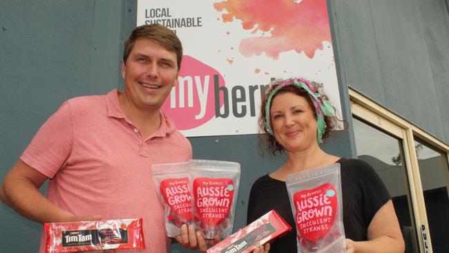 Stuart and Allison McGruddy with their strawberries and the new Tim Tams. Photo: Alan Quinney