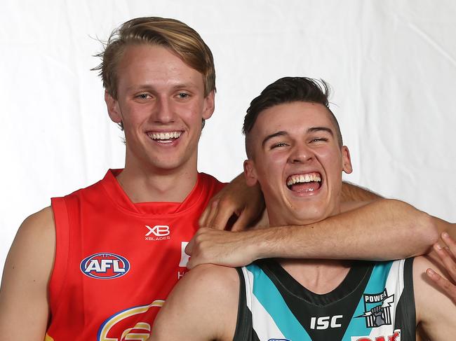 2018 AFL Draft at Marvel Stadium, Melbourne.  Jack Lukosius and Izak Rankine razz up Connor Rozee   . Pic: Michael Klein