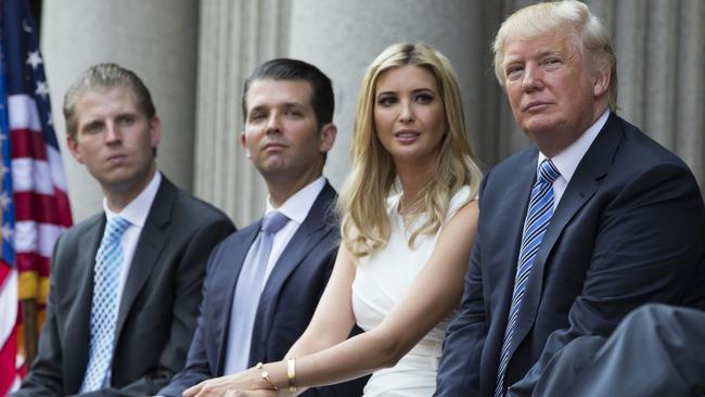 Donald Trump, right, sits with three of his children, pictured from left: Eric, Donald Jr., and Ivanka. Chairwoman of the Manhattan Republican Party, Andrea Catsimatidis, said of Trump’s grown-up offspring: “They’re some of the nicest, most down-to-earth people I’ve ever met.” Picture: AP